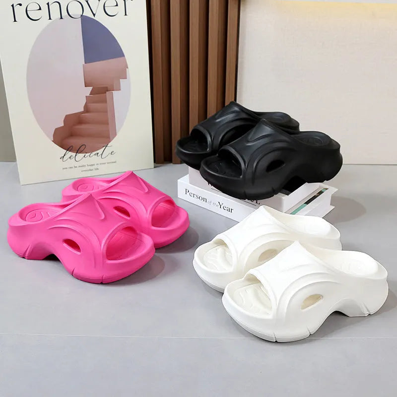 Women's thick-soled EVA beach slippers in white, black, and rose red colours with round toe design