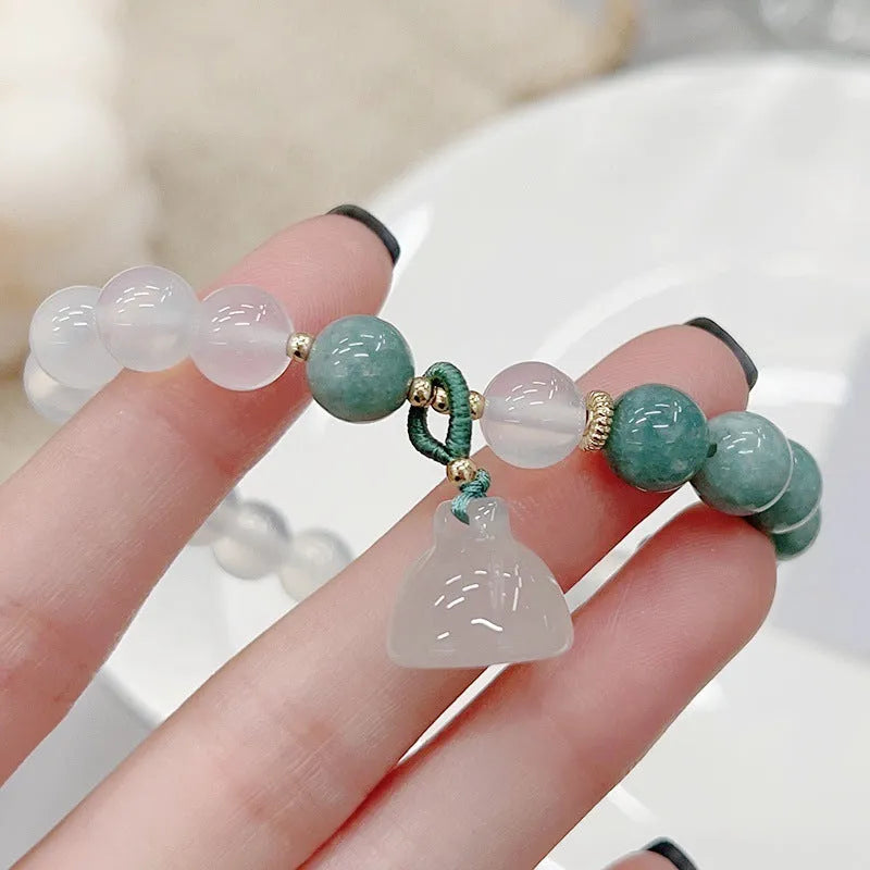 Women's retro Chinese style agate bracelet with carved lotus seedpod design