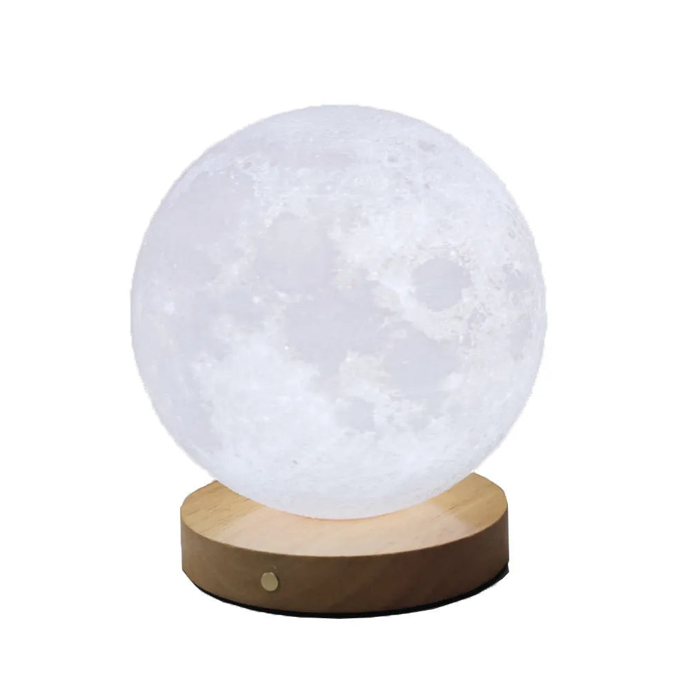 Rotating moon night light on a wooden base with a wire remote, shown in three available sizes.