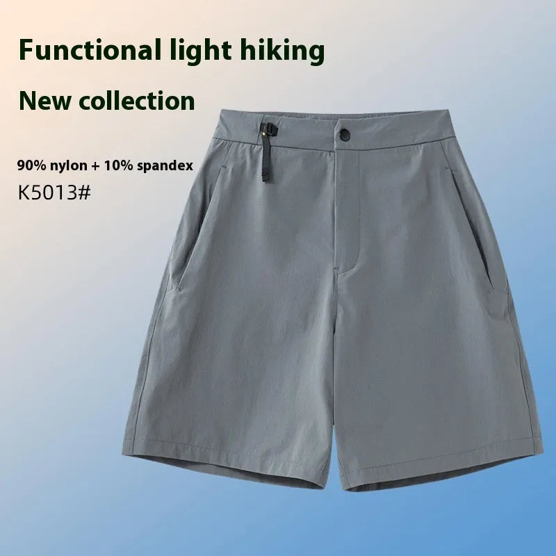 Man wearing solid-colour quick-dry sports shorts with an elastic waistband for running or climbing.