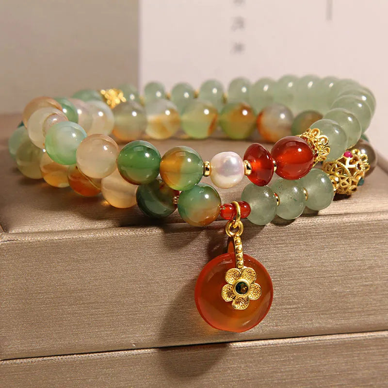 Peacock green agate double ring bracelet for women with safety buckle clasp and rhinestone details.