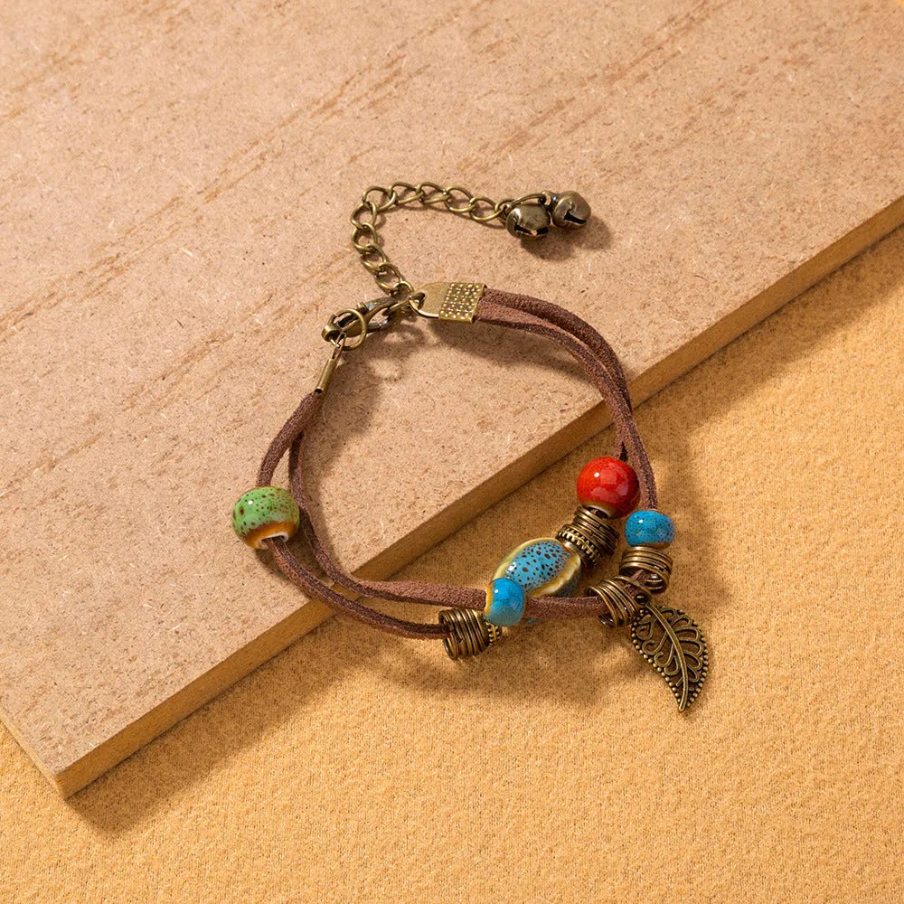 Hand-woven cowhide rope bracelet with ceramic beads in blue or white geometric bohemian style