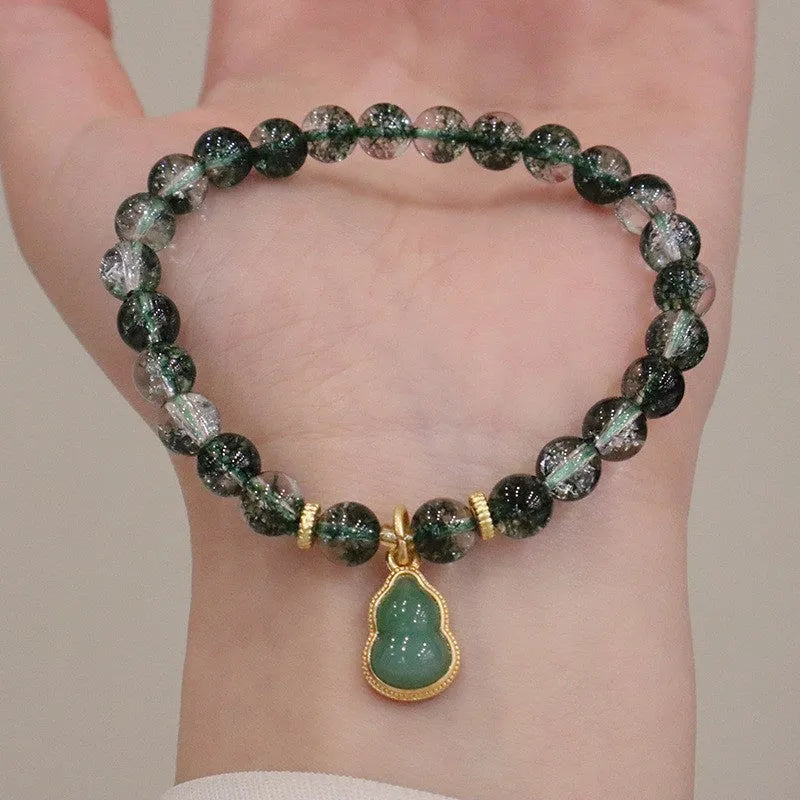 Women's crystal bracelet with citrine, chorite beads and green phantom quartz ghost calabash pendant.