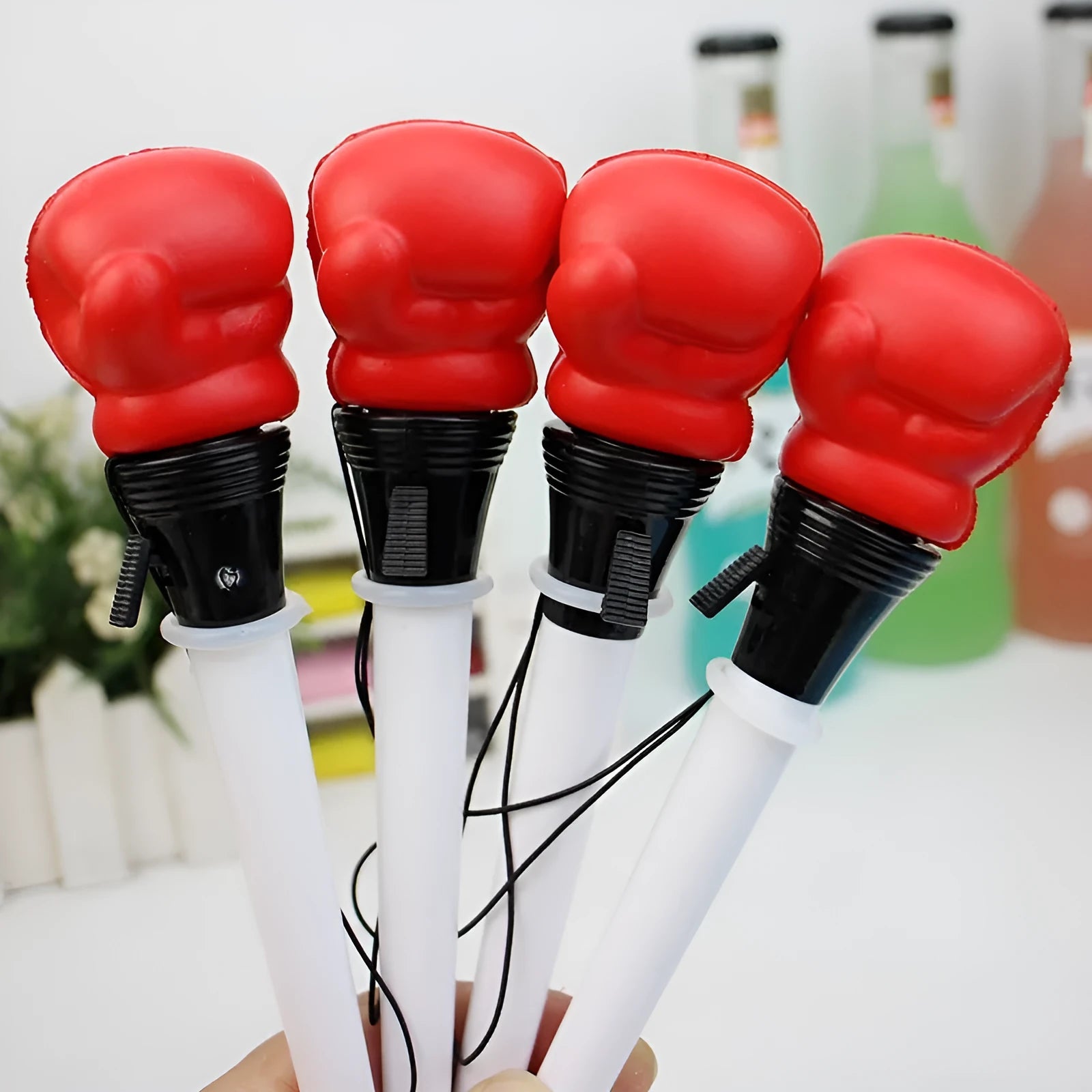 Four boxing press ejection pens with black ink refills and 0.7mm bullet-shaped tips