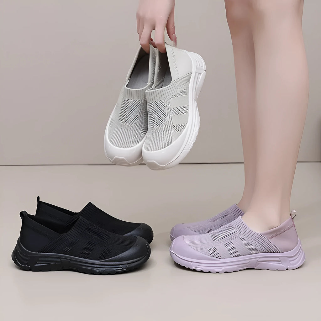 Women's black slip-on shoes with cloth uppers and soft PVC soles