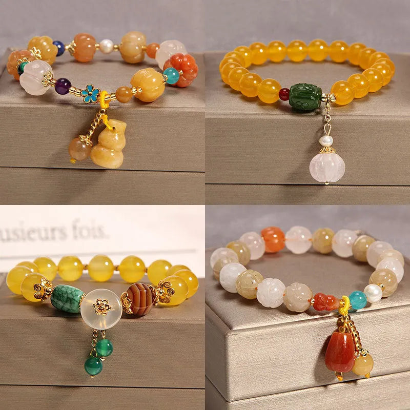 Khaki women's bracelet with yellow agate crystals threaded on a gold silk cord.