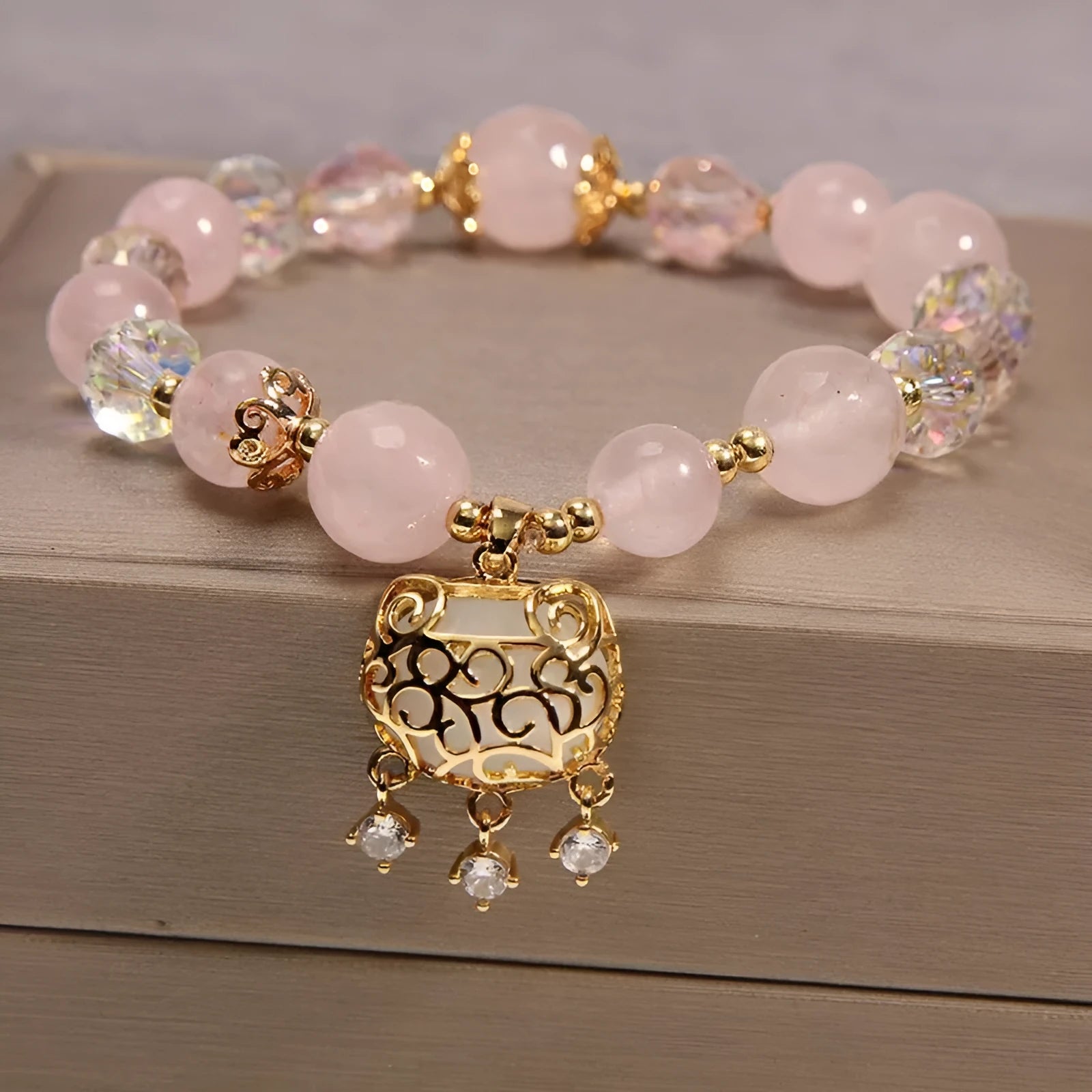 Khaki women's bracelet with yellow agate crystals threaded on a gold silk cord.
