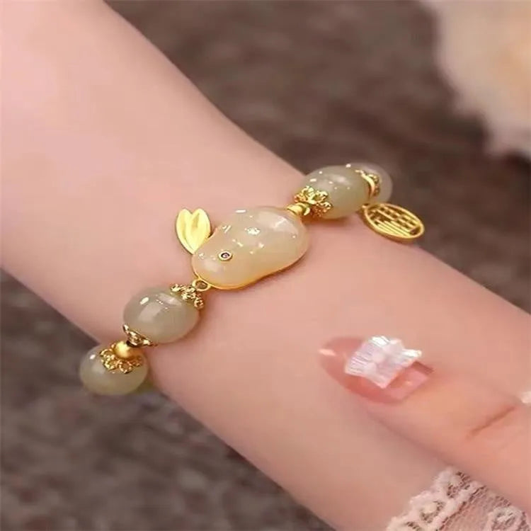 Green electroplated bracelet with a Chinese style hare charm and lily decoration for women.
