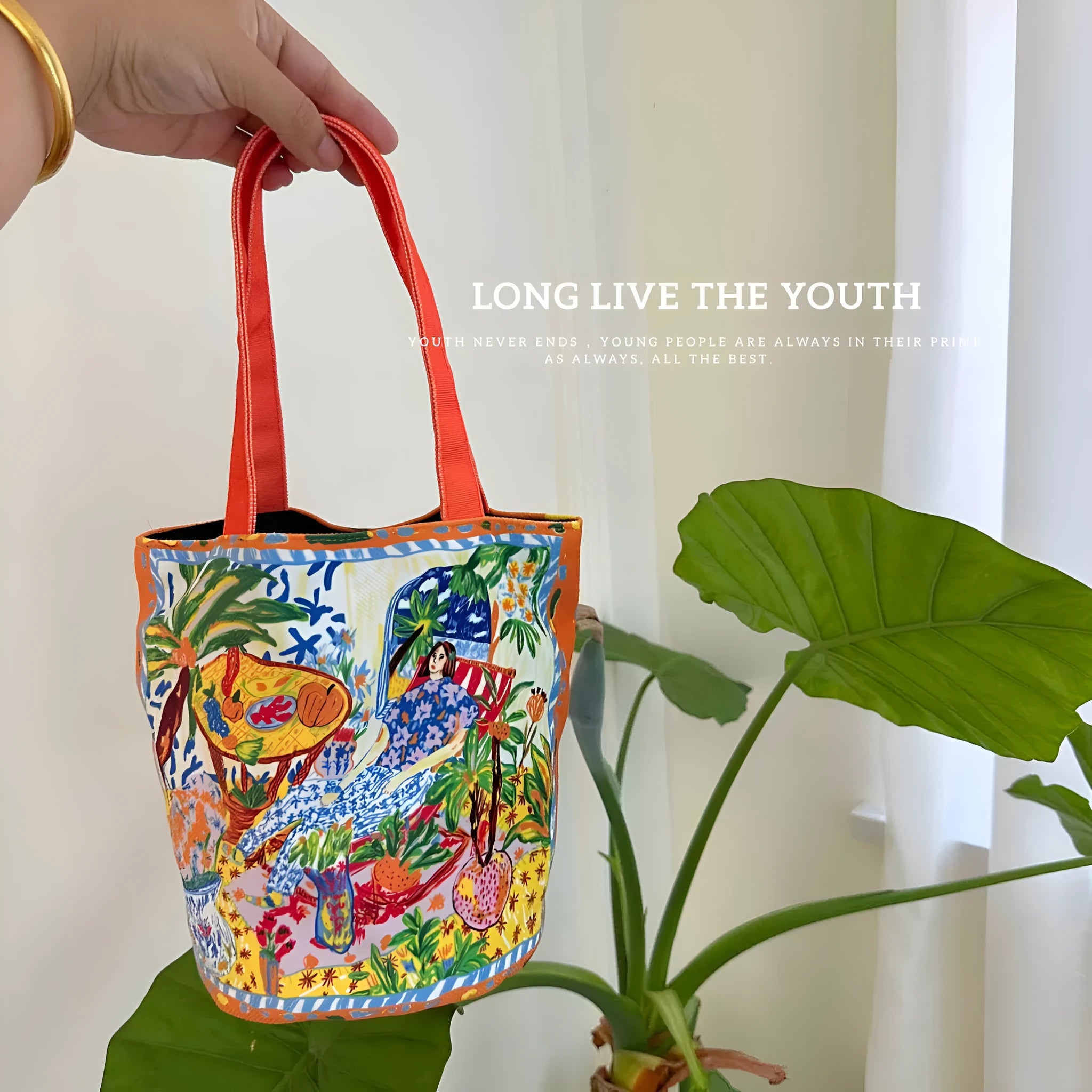 Dream Garden orange plush canvas Thailand artistic bucket bag with double straps and printed details.