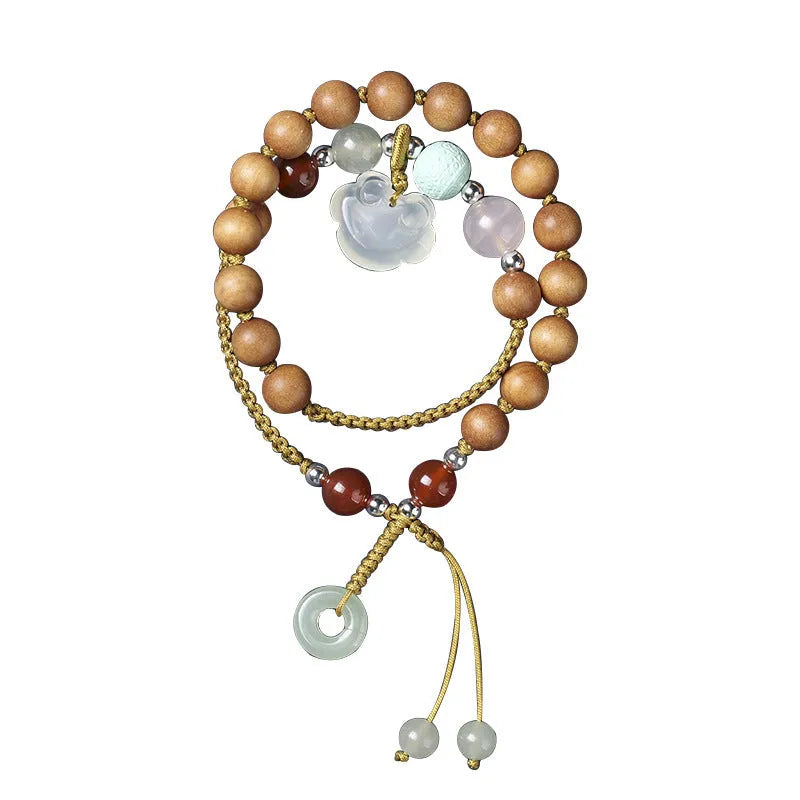 Women's ebony double ring bracelet with hand-woven construction and traditional Ruyi design elements