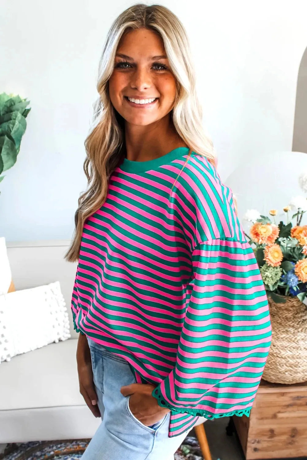 Women's striped crew neck long sleeve top in black loose fit polyester front view