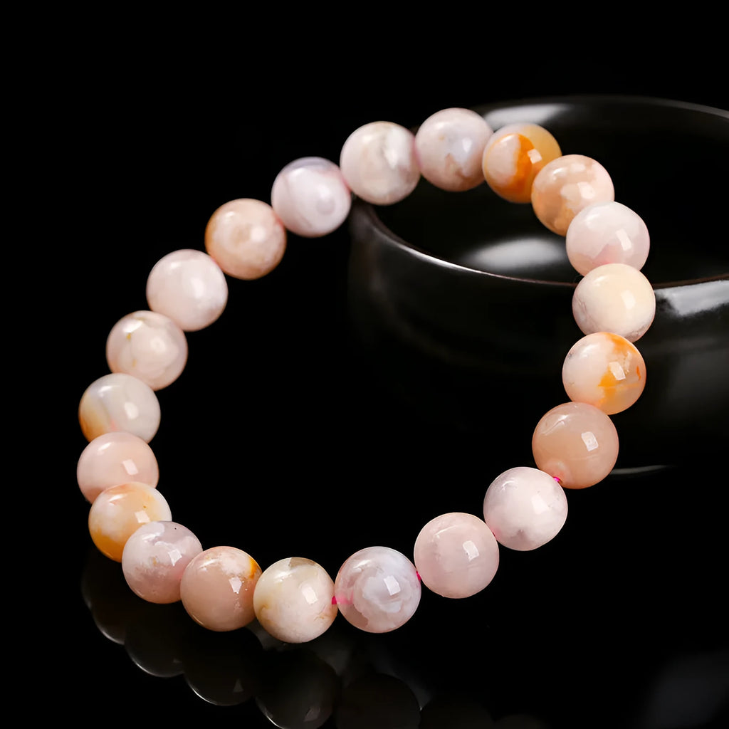Cherry agate bracelet in natural cherry blossom colour with round geometric beads.