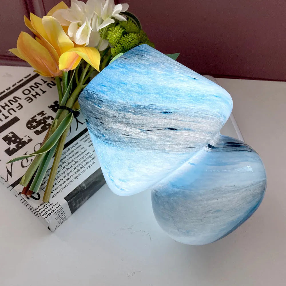 Handmade glass mushroom table lamp in Earth colour on wooden bedside table, 15cm by 19cm