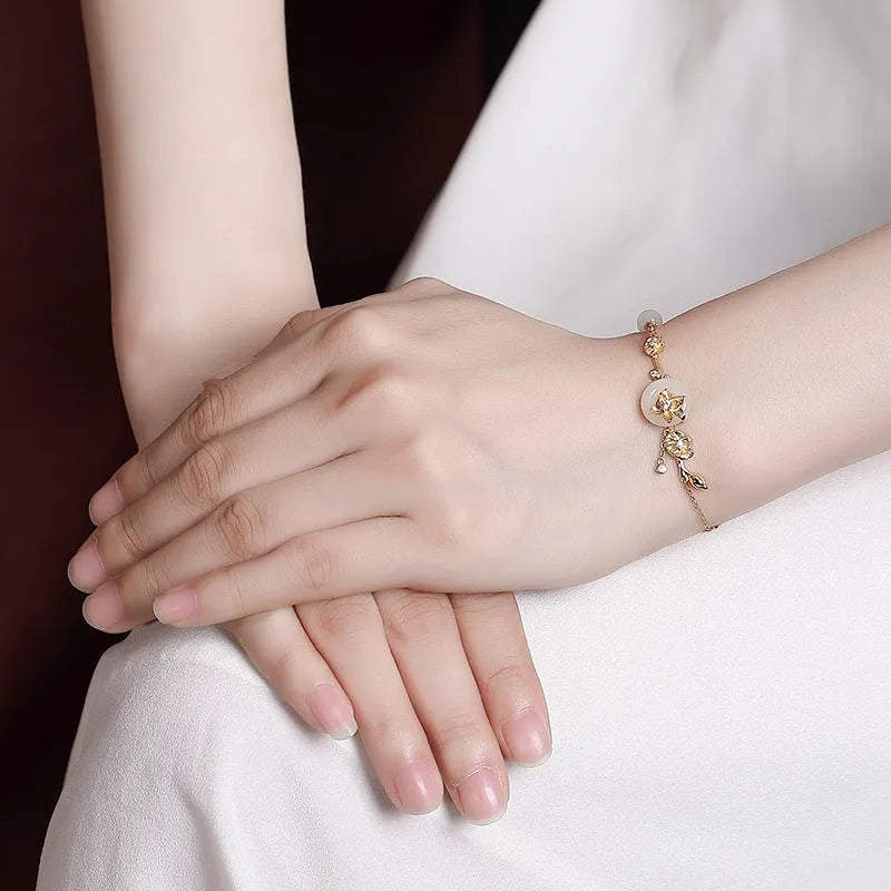 Women's antique silver bracelet with peace buckle clasp and inlaid Hetian jade lotus charm