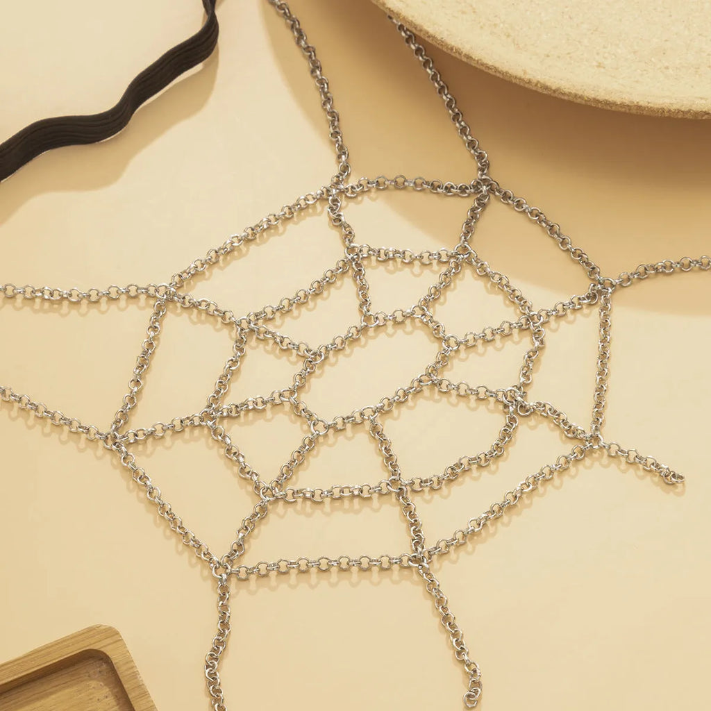 Women's geometric body chain in silver, made from alloy with electroplated finish, shown as an anklet