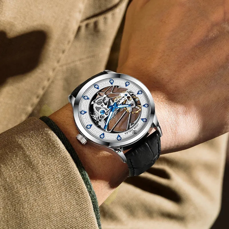 Men's silver mechanical watch with white dial, blue hands and black leather strap