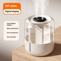 Beige round USB humidifier with dual spray nozzles, digital display, and night light on a table