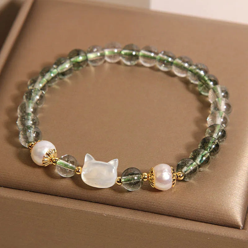 Green phantom quartz women's bracelet with a delicate shell kitten charm.