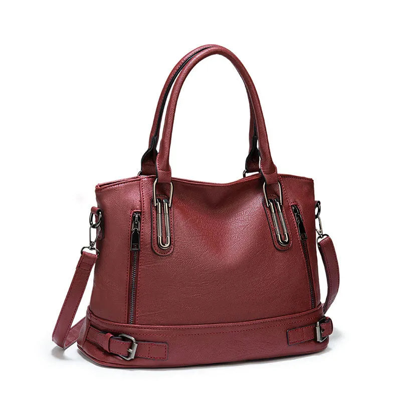Women's PU leather handbag in black, horizontal square shape, with crossbody strap and sewing line detail