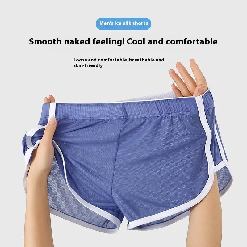 Men's black ice silk low waist sports boxers with mesh detail on a plain background.