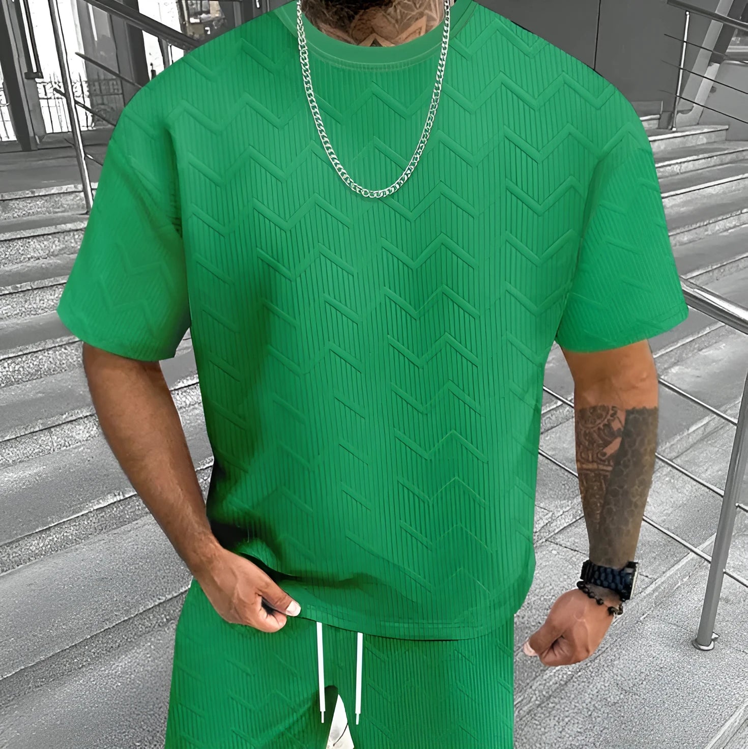 Men's short sleeve top and shorts suit with printed pattern for sports leisure wear.