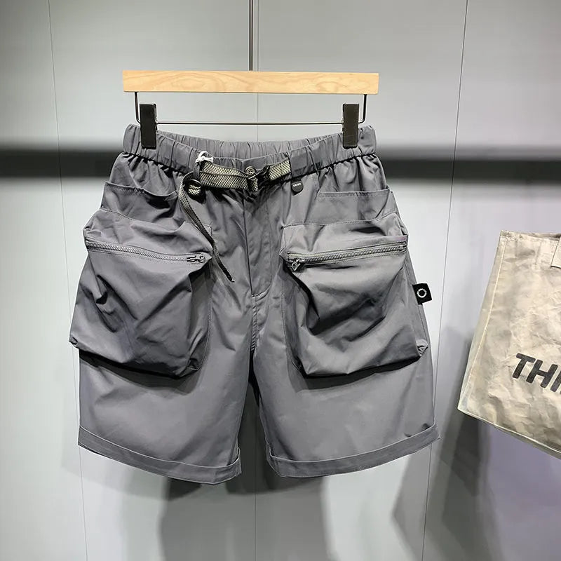 Men's black workwear shorts with multiple pockets and loose fitting design