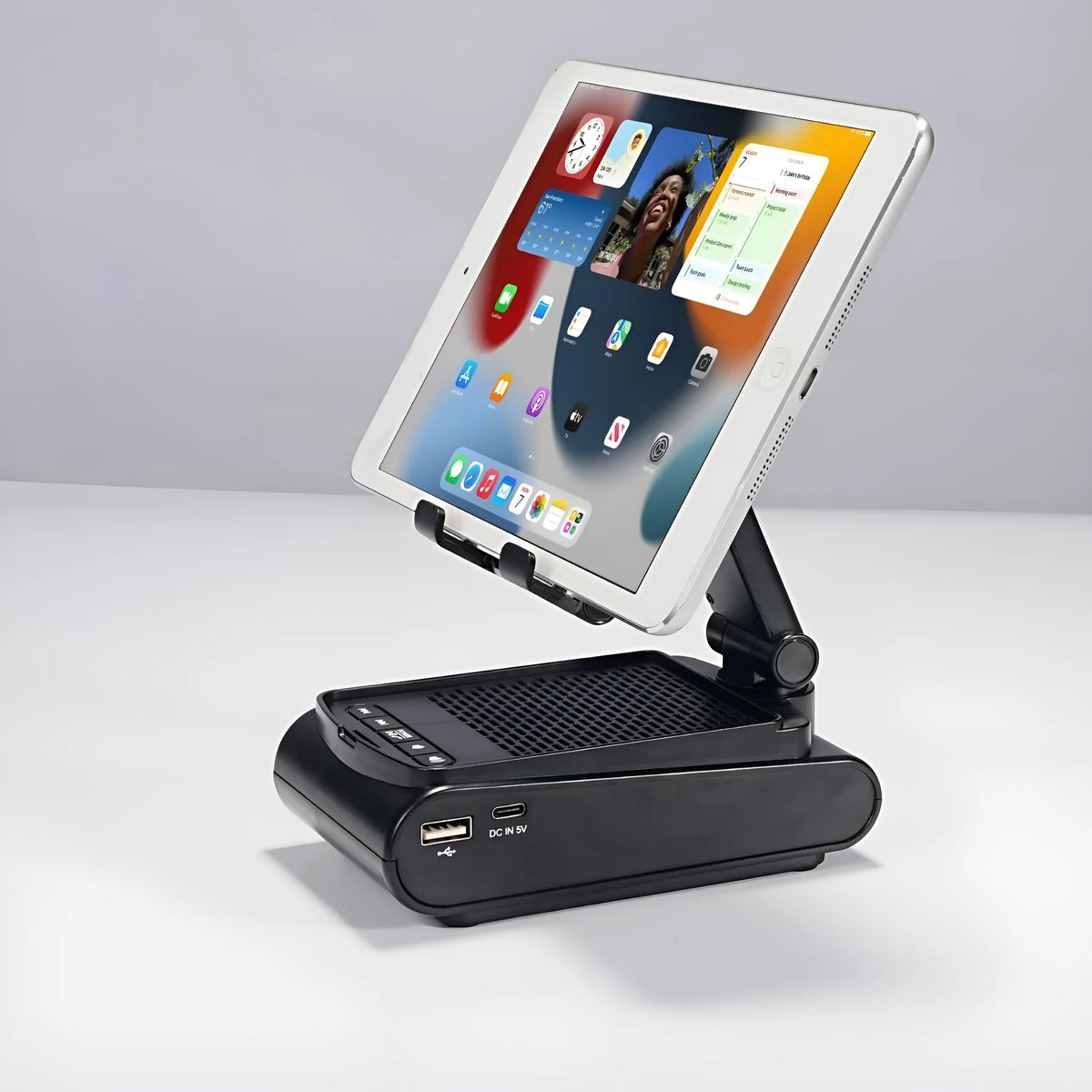 Multi-function lazy phone holder with Bluetooth audio speaker in black plastic, USB powered