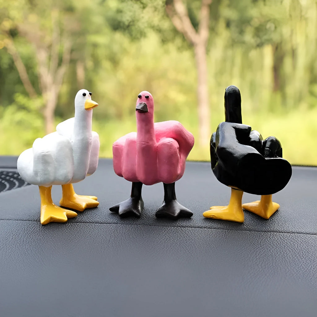 Creative middle finger duck cartoon resin ornament in beige, 50x77mm, on car centre console