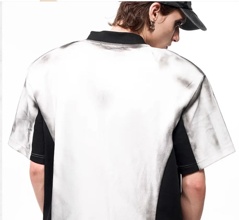 Women's V-neck short sleeve top with black and white letter snake pattern print and padded shoulders.