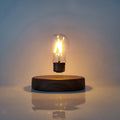 Magnetic levitation bulb night light in solid wood colour floating above desktop base