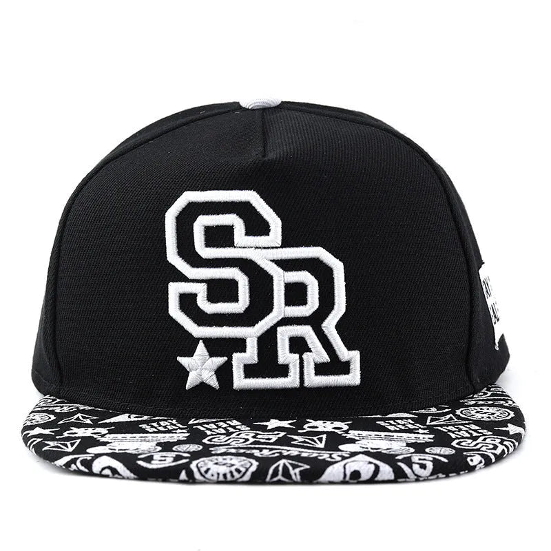 Black and white adjustable cotton baseball cap with embroidered lettering and dome crown.