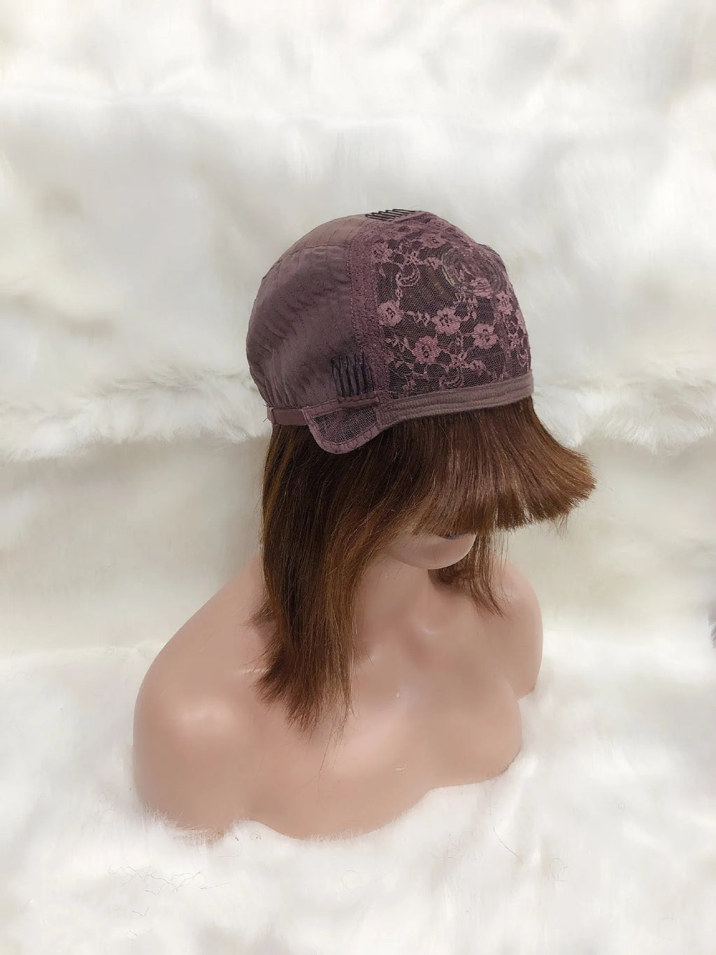 Full Mechanic 4 27 Bob human hair wig in brown with straight bangs, medium length on a mannequin head