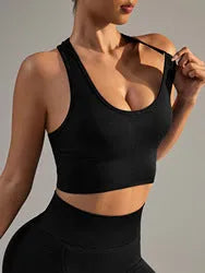Black cross-back sports bra with moulded cups and fixed double straps on a mannequin