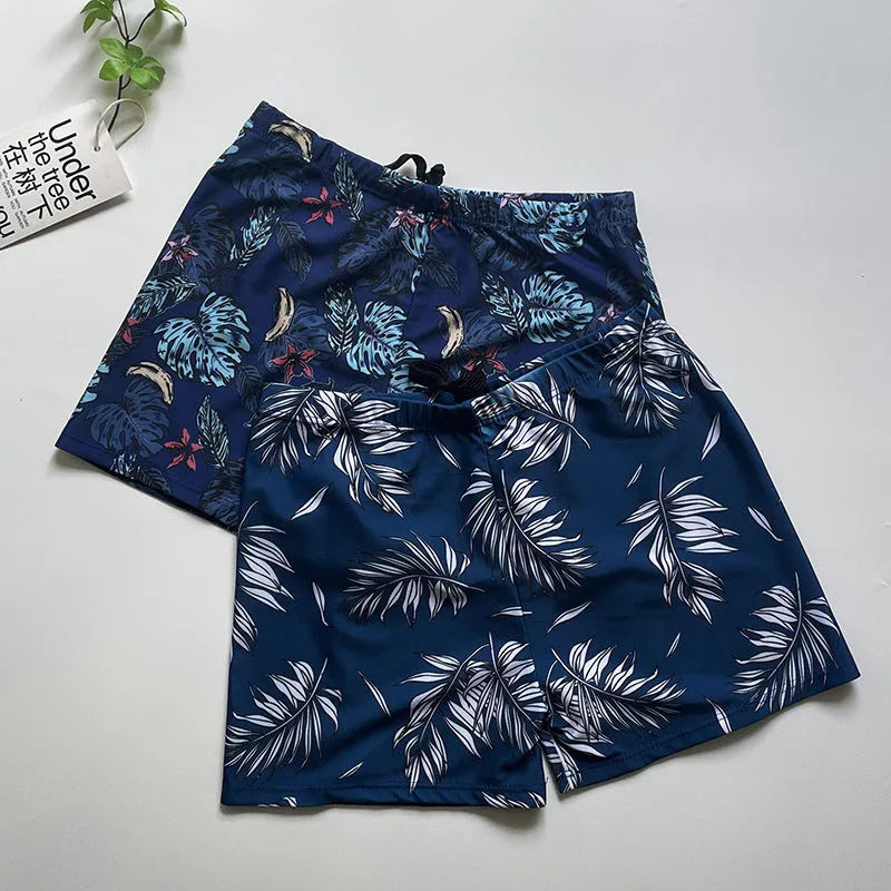 Men's loose fit anti-embarrassment swimming trunks in dark blue background big flower pattern, polyester fabric