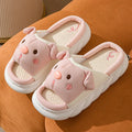 White linen open toe flip flop slippers for couples on a light background, showing PVC sole and strap detail.