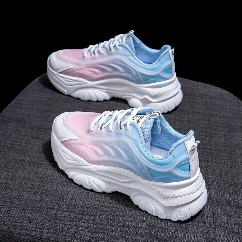 Women's pink satin lace-up casual shoes with round toe on a white background.