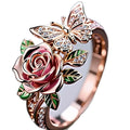 Adjustable colourful butterfly ring with oil droplet treatment and floral detailing