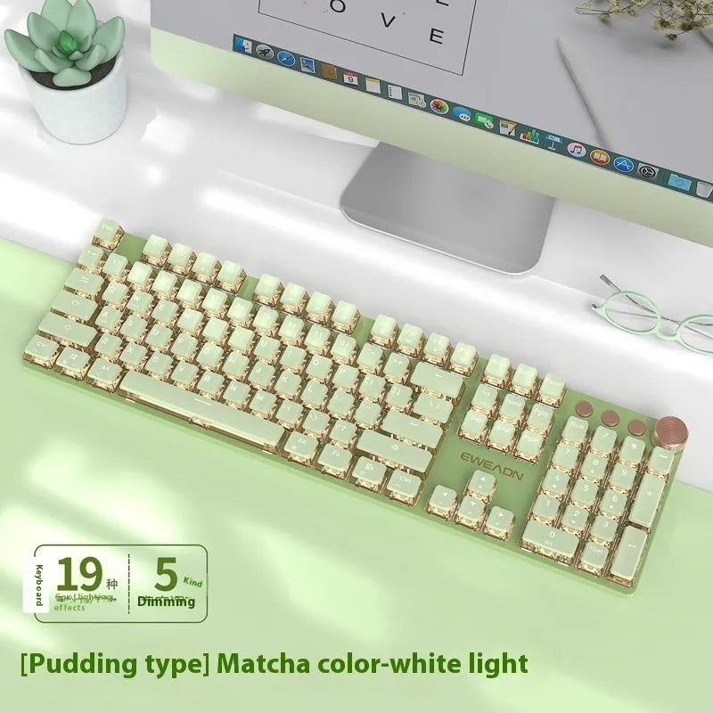 Matcha green 87-key mechanical gaming keyboard with aluminium frame and white backlighting on a desk.
