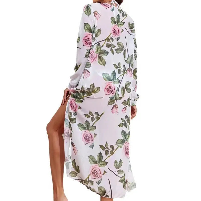 Women's white printed three-piece bikini set showing bra, shorts, and blouse coat laid flat.