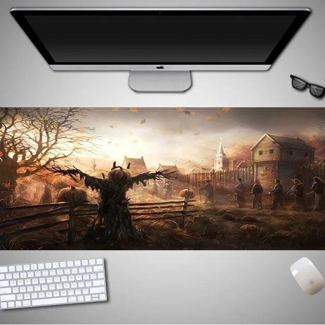 Oversized Halloween gaming mouse pad with non-slip rubber base on a desk