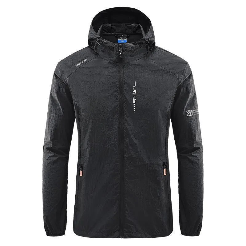 Man wearing a lightweight grey hooded nylon jacket suitable for summer outdoor activities.