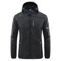 Man wearing a lightweight grey hooded nylon jacket suitable for summer outdoor activities.