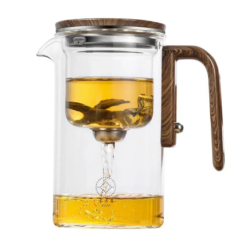 Innovative glass teapot with magnetic separation technology, wooden handle, and clear design for brewing and serving tea