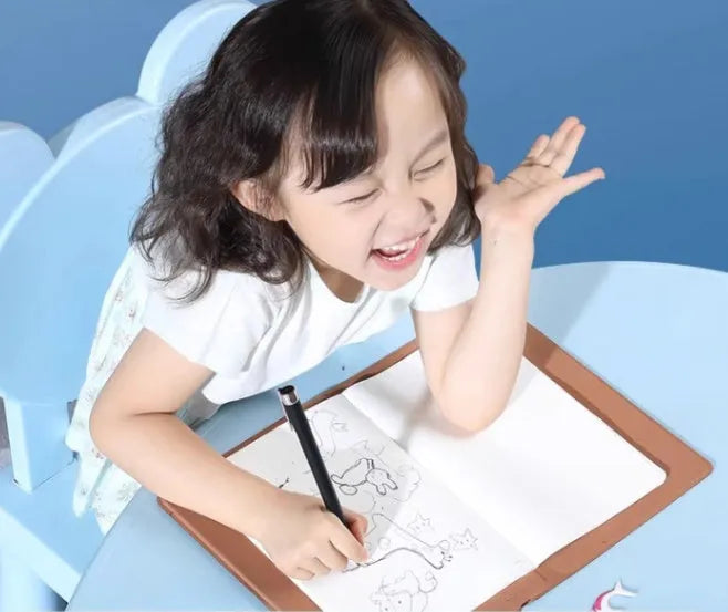 Huion Note X10 Elk Brown digital drawing tablet with PW320 pen on a desk