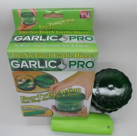Green transparent plastic garlic peeler with silicone roller for removing skins.