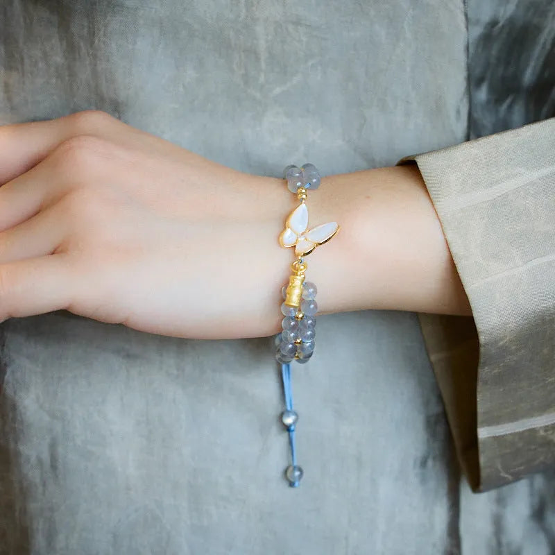 Grey moonstone woven bracelet with butterfly knots and geometric retro design