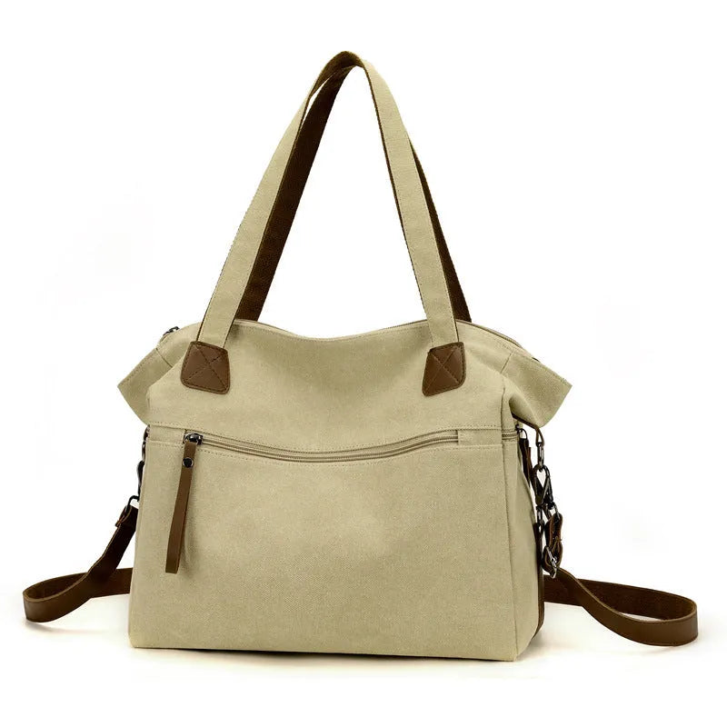 Women's retro style canvas shoulder bag with internal organiser pockets in horizontal square shape