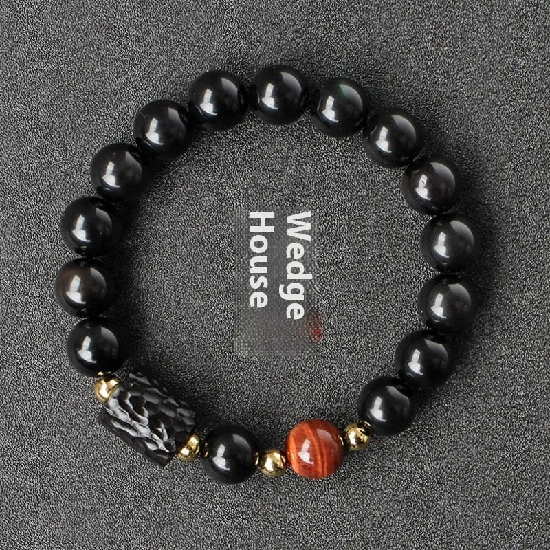 Obsidian bracelet with tiger eye beads in 10mm size showing manual craftsmanship and unisex design
