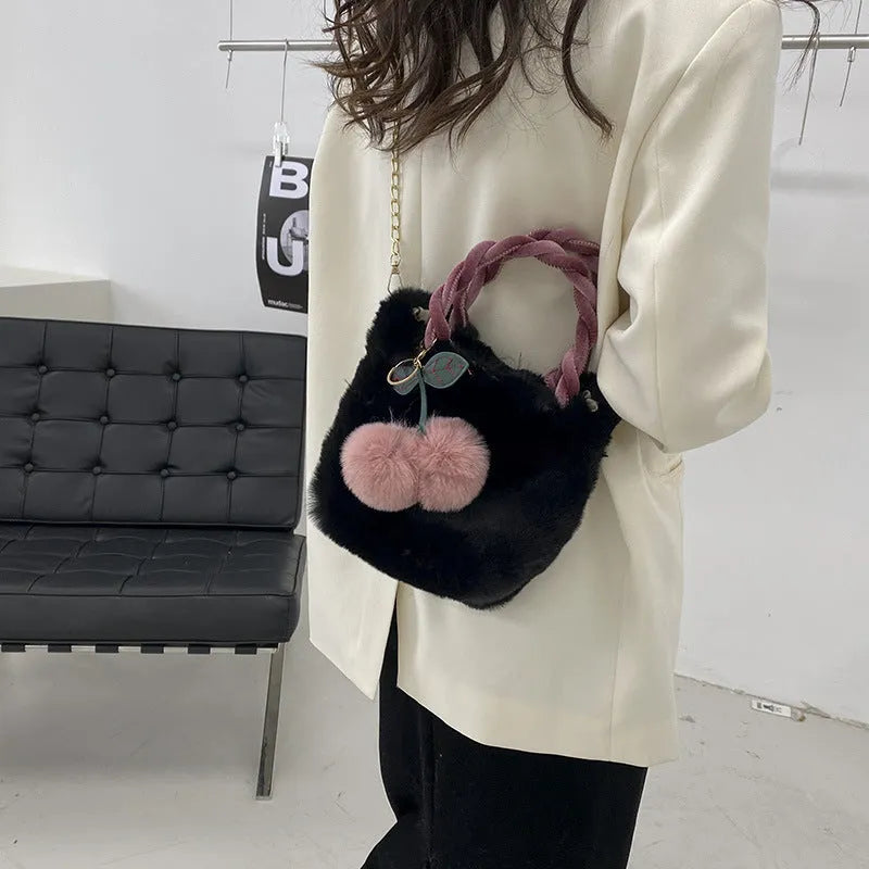 Large soft plush travel bucket bag in beige with open pocket and single shoulder strap