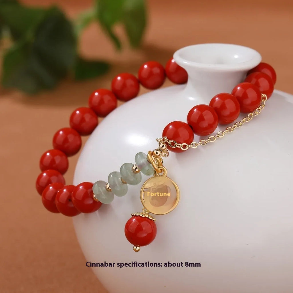 Retro red cinnabar bracelet with carved fu character, jade bead, and leather tassel cord